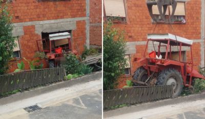 Traktor u zidu kuće